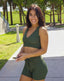 Matching olive green gym set for women. Pperfect gym set to go running, jogging, or even yoga class. Shop our premium gym shorts with adjustable straps for comfort.