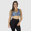 Best sports bra for comfort. Best activewear online for women. Sports wear with plus size women in mind. Wearing scrunch booty leggings in black. Leopard blue bra with zebra stripes and leopard print.